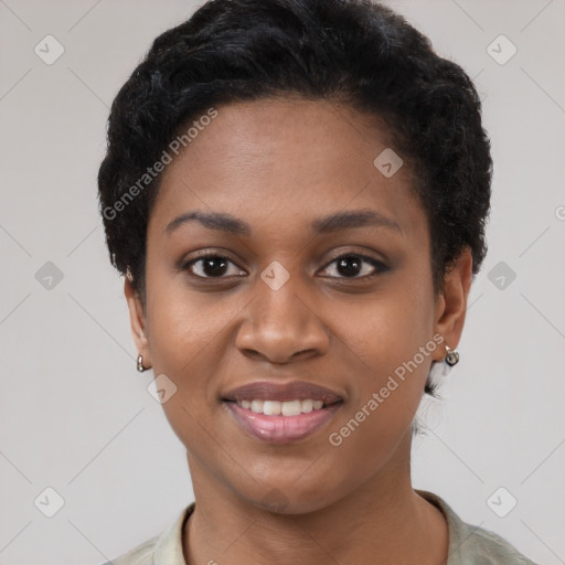 Joyful black young-adult female with short  black hair and brown eyes