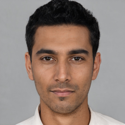 Neutral latino young-adult male with short  black hair and brown eyes