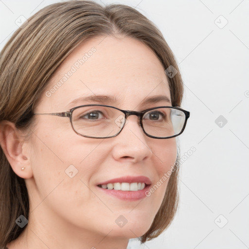 Joyful white adult female with medium  brown hair and blue eyes