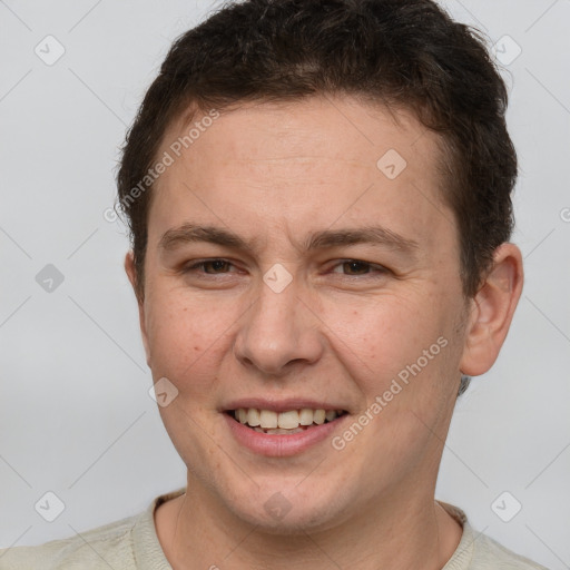 Joyful white adult male with short  brown hair and brown eyes