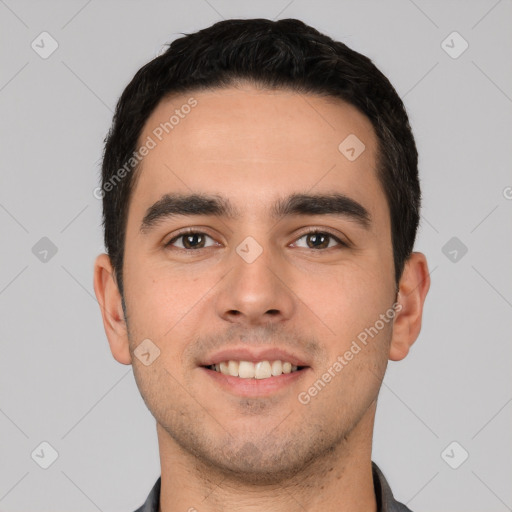 Joyful white young-adult male with short  black hair and brown eyes