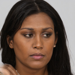 Neutral asian young-adult female with long  brown hair and brown eyes