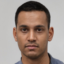 Neutral white young-adult male with short  black hair and brown eyes