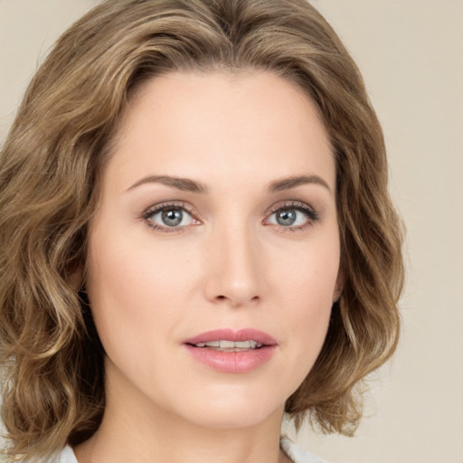 Joyful white young-adult female with medium  brown hair and green eyes