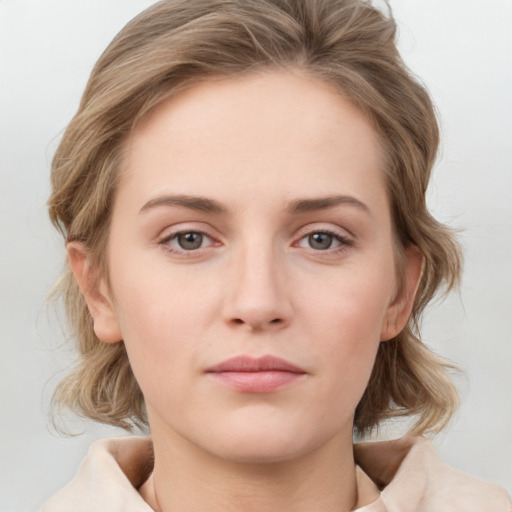 Neutral white young-adult female with medium  brown hair and grey eyes