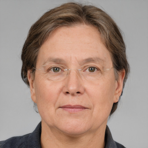 Joyful white middle-aged female with medium  brown hair and grey eyes