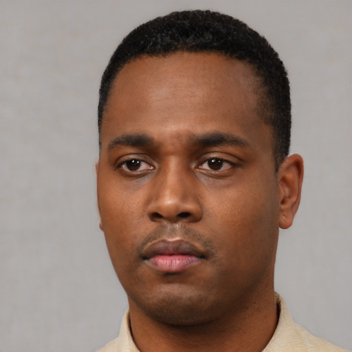 Neutral black young-adult male with short  black hair and brown eyes