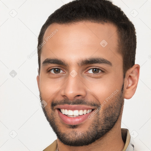 Joyful white young-adult male with short  brown hair and brown eyes