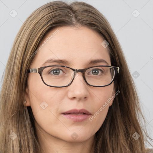 Joyful white young-adult female with long  brown hair and blue eyes