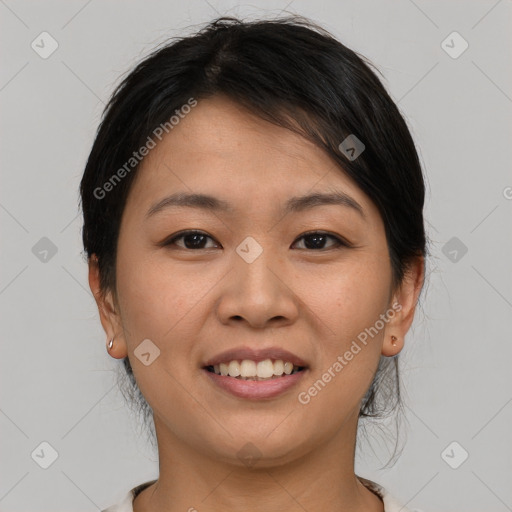 Joyful asian young-adult female with short  brown hair and brown eyes