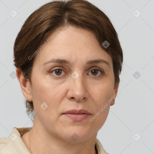 Joyful white adult female with short  brown hair and grey eyes