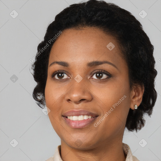 Joyful black young-adult female with medium  black hair and brown eyes