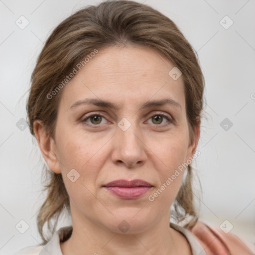 Joyful white adult female with medium  brown hair and grey eyes