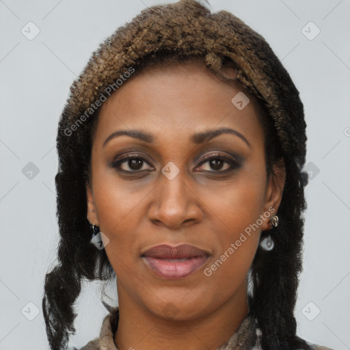 Joyful black young-adult female with long  brown hair and brown eyes