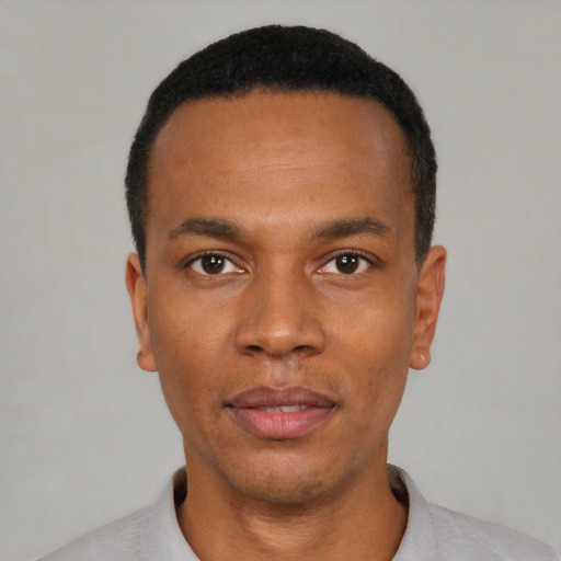 Neutral black young-adult male with short  black hair and brown eyes