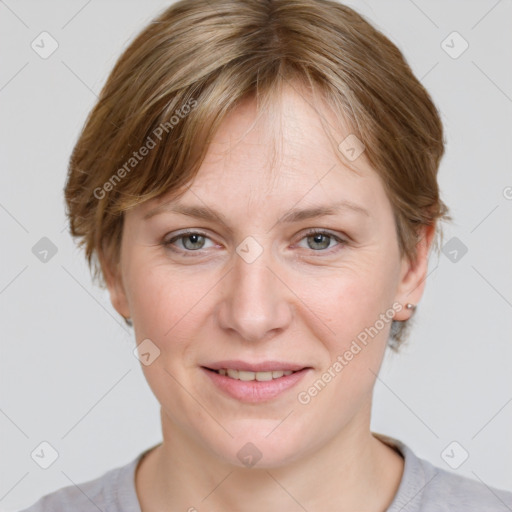 Joyful white adult female with medium  brown hair and grey eyes