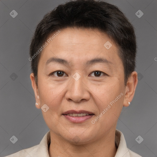 Joyful white adult female with short  brown hair and brown eyes