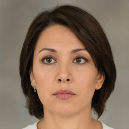 Neutral asian young-adult female with medium  brown hair and brown eyes