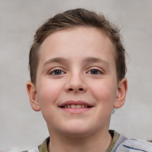 Joyful white child female with short  brown hair and blue eyes