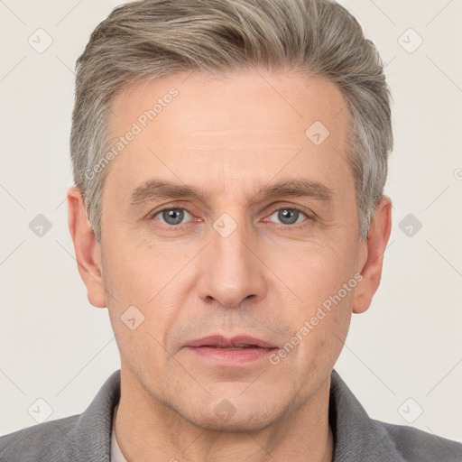 Neutral white adult male with short  brown hair and grey eyes