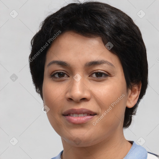 Joyful latino young-adult female with short  black hair and brown eyes