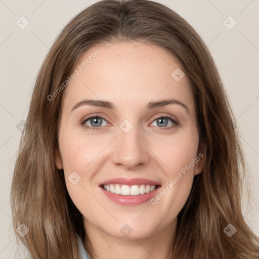 Joyful white young-adult female with long  brown hair and green eyes