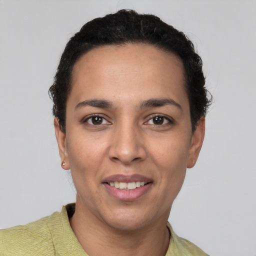 Joyful white young-adult female with short  black hair and brown eyes