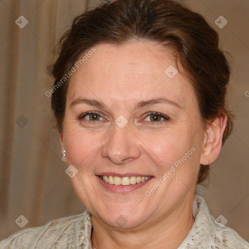 Joyful white adult female with medium  brown hair and blue eyes