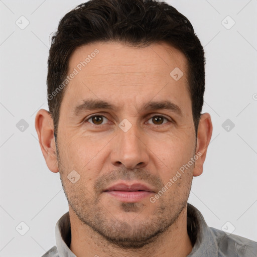 Joyful white adult male with short  brown hair and brown eyes