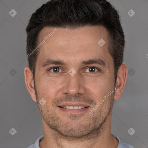 Joyful white adult male with short  brown hair and brown eyes