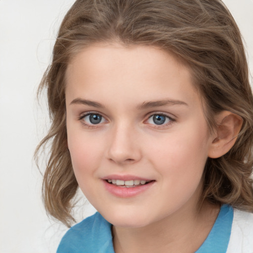 Joyful white child female with medium  brown hair and brown eyes