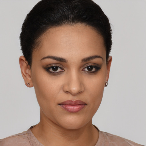 Joyful latino young-adult female with short  brown hair and brown eyes