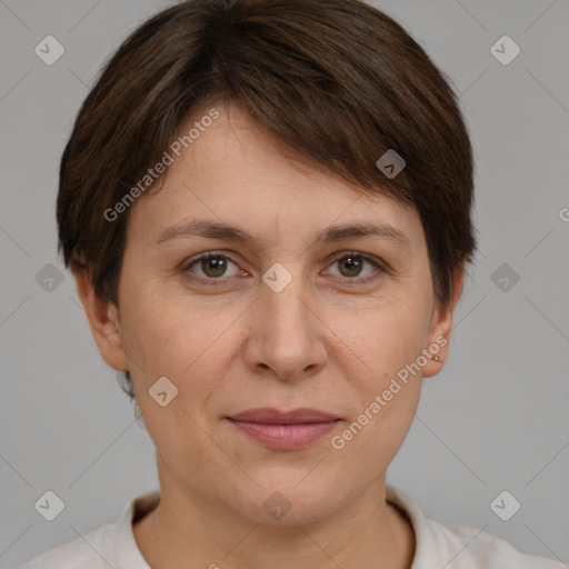 Joyful white adult female with short  brown hair and brown eyes