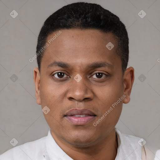 Joyful black young-adult male with short  black hair and brown eyes