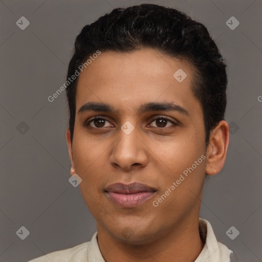 Joyful latino young-adult male with short  black hair and brown eyes