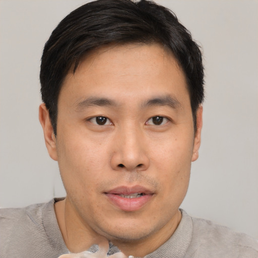 Neutral asian young-adult male with short  brown hair and brown eyes