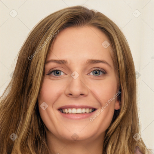 Joyful white young-adult female with long  brown hair and green eyes