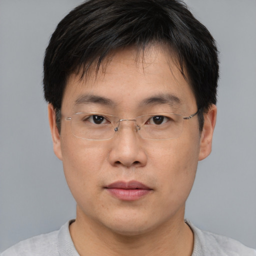 Neutral asian adult male with short  brown hair and brown eyes
