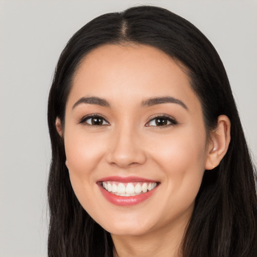 Joyful white young-adult female with long  black hair and brown eyes