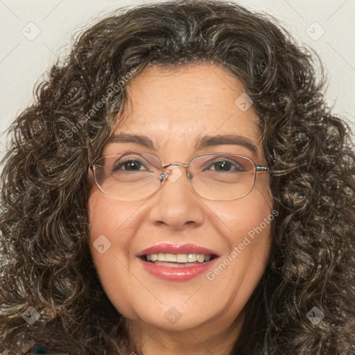 Joyful white adult female with long  brown hair and brown eyes