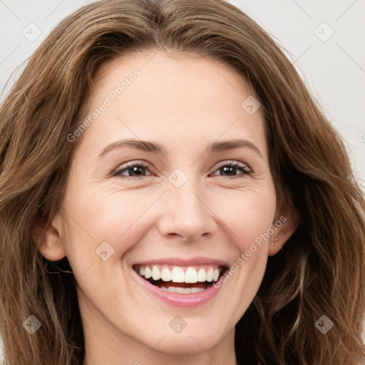 Joyful white young-adult female with long  brown hair and green eyes