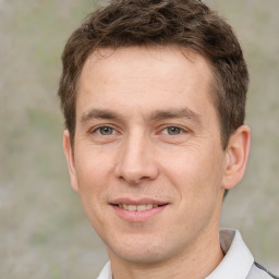 Joyful white adult male with short  brown hair and brown eyes