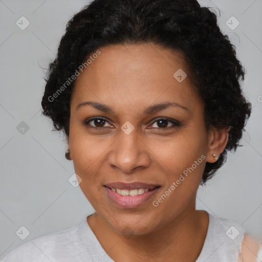 Joyful black adult female with short  brown hair and brown eyes