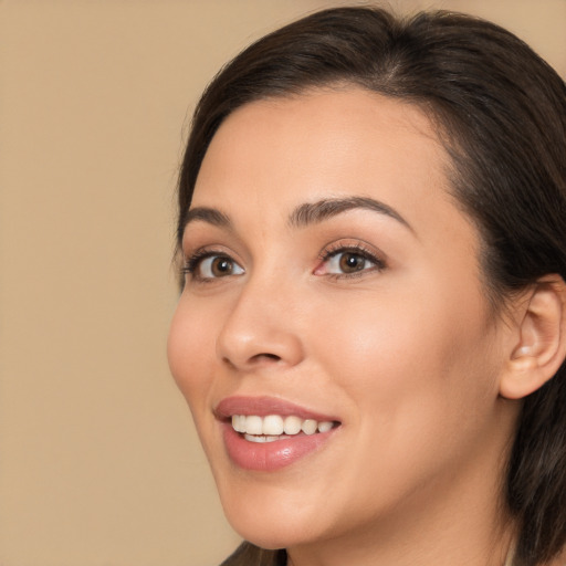 Joyful white young-adult female with medium  brown hair and brown eyes