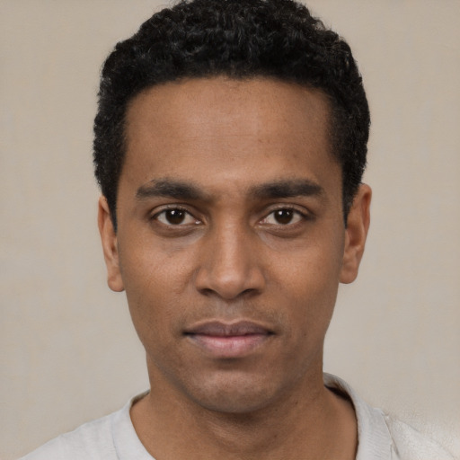 Neutral black young-adult male with short  black hair and brown eyes