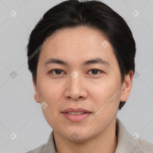 Joyful asian adult male with short  brown hair and brown eyes