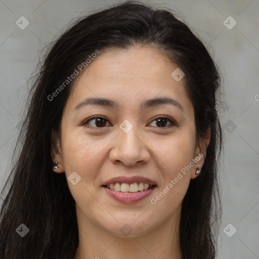 Joyful latino young-adult female with long  brown hair and brown eyes