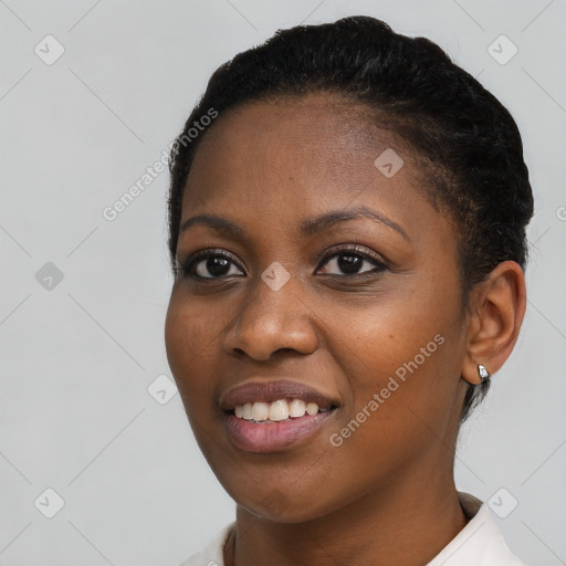 Joyful black young-adult female with short  black hair and brown eyes