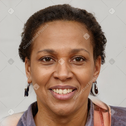 Joyful latino adult female with short  brown hair and brown eyes