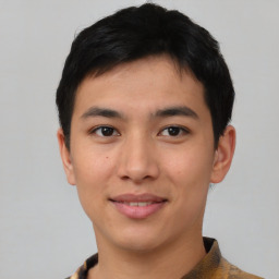 Joyful asian young-adult male with short  black hair and brown eyes